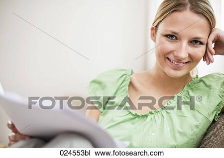 portrait of young woman at home reading letter View Large Photo Image Stock Image - portrait of young woman at home reading letter. Fotosearch