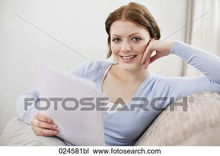 portrait of young woman at home reading letter View Large Photo Image Stock Image - portrait of young woman at home reading letter. Fotosearch