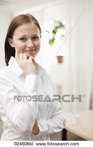 Stock Image - portrait of young woman at home. Fotosearch