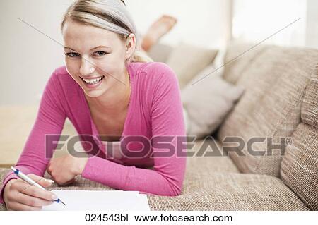 portrait of young woman at home working on personal finance View Large Photo Image Stock Image - portrait of young woman at home working on personal finance. Fotosearch