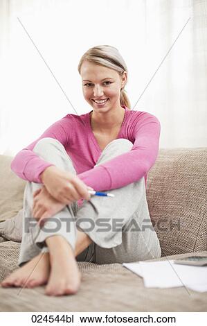 portrait of young woman at home working on personal finance View Large Photo Image Stock Image - portrait of young woman at home working on personal finance. Fotosearch