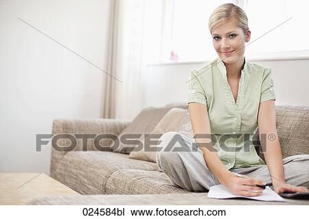 portrait of young woman at home working on personal finance View Large Photo Image Stock Image - portrait of young woman at home working on personal finance. Fotosearch