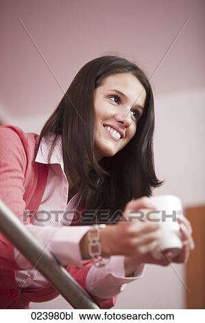 portrait of young woman having coffee break View Large Photo Image Stock Image - portrait of young woman having coffee break. Fotosearch