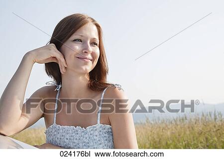 portrait of young woman in summer leaning against car View Large Photo Image Stock Image - portrait of young woman in summer leaning against car. Fotosearch