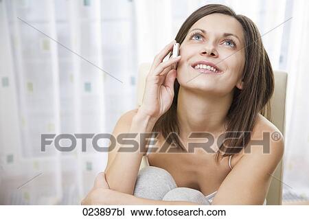 portrait of young woman talking on mobile phone View Large Photo Image Stock Image - portrait of young woman talking on mobile phone. Fotosearch