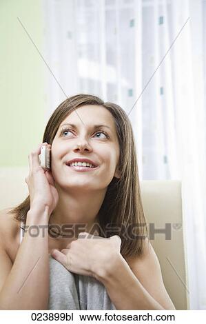 portrait of young woman talking on mobile phone View Large Photo Image Stock Image - portrait of young woman talking on mobile phone. Fotosearch