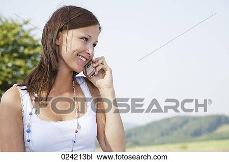 portrait of young woman talking on mobile phone View Large Photo Image Stock Image - portrait of young woman talking on mobile phone. Fotosearch