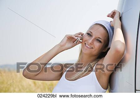 portrait of young woman talking on mobile phone View Large Photo Image Stock Image - portrait of young woman talking on mobile phone. Fotosearch