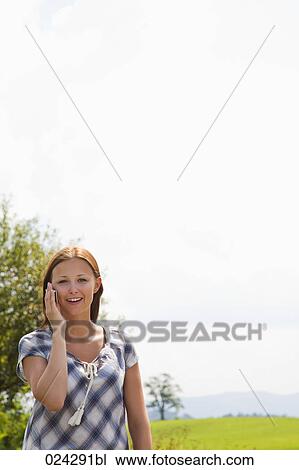 portrait of young woman talking on mobile phone View Large Photo Image Stock Image - portrait of young woman talking on mobile phone. Fotosearch