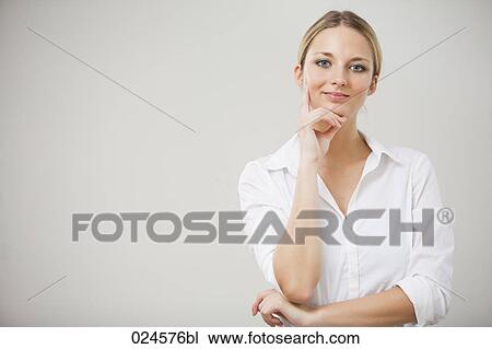 Stock Image - portrait of young woman thinking. Fotosearch