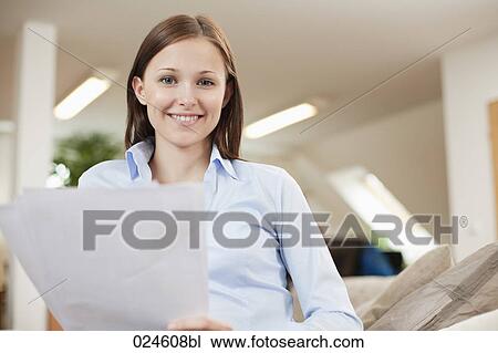 Stock Image - portrait of young woman with document. Fotosearch