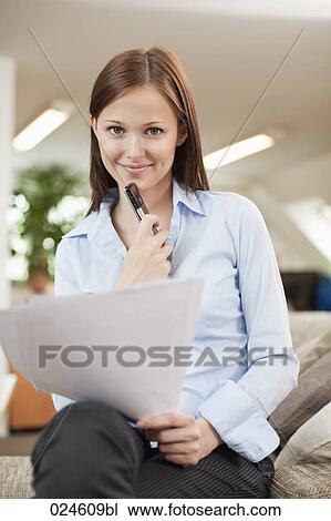 Stock Image - portrait of young woman with document. Fotosearch