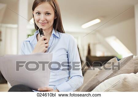 Stock Image - portrait of young woman with document. Fotosearch