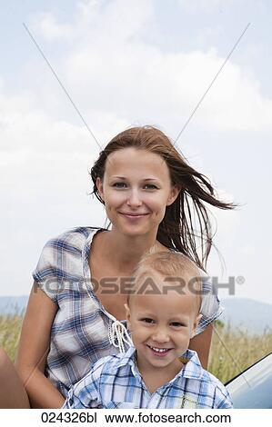 Stock Image - portrait of young woman with her son. Fotosearch