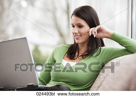 portrait of young woman with laptop computer at home View Large Photo Image Stock Image - portrait of young woman with laptop computer at home. Fotosearch