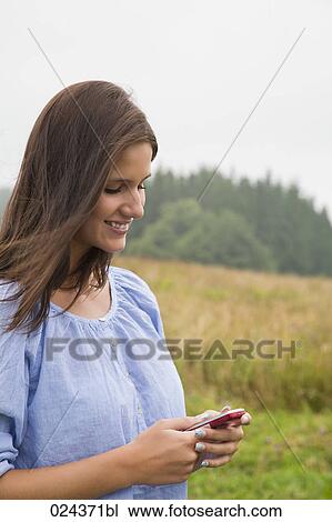 portrait of young woman with mobile phone View Large Photo Image Stock Image - portrait of young woman with mobile phone. Fotosearch