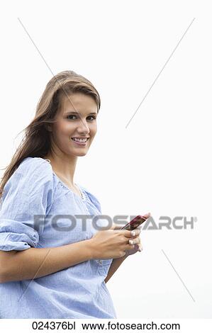 portrait of young woman with mobile phone View Large Photo Image Stock Image - portrait of young woman with mobile phone. Fotosearch