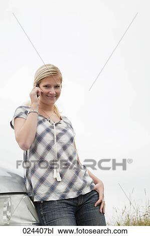 portrait of young woman with mobile phone View Large Photo Image Stock Image - portrait of young woman with mobile phone. Fotosearch