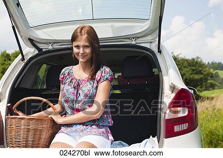 portrait of young young woman with picnic baset at car View Large Photo Image Stock Image - portrait of young young woman with picnic baset at car. Fotosearch