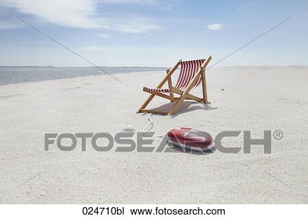 sunlounger and computer mouse on sandy beach View Large Photo Image Stock Image - sunlounger and computer mouse on sandy beach. Fotosearch