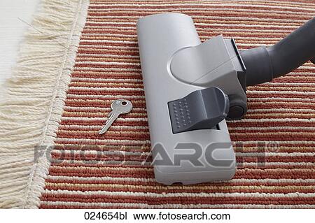 vacuum cleaner accidentally vacuuming key on carpet View Large Photo Image Stock Image - vacuum cleaner accidentally vacuuming key on carpet. Fotosearch