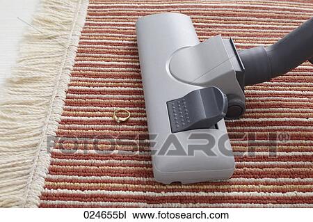 vacuum cleaner accidentally vacuuming ring on carpet View Large Photo Image Stock Image - vacuum cleaner accidentally vacuuming ring on carpet. Fotosearch