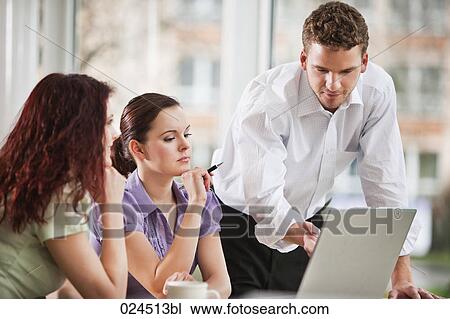 young businessman giving presentation to female colleagues View Large Photo Image Stock Image - young businessman giving presentation to female colleagues. Fotosearch
