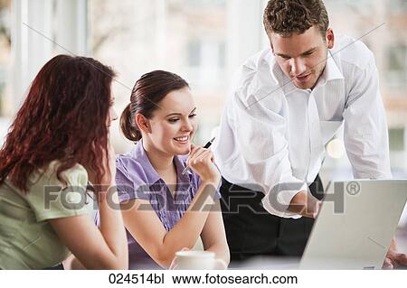 young businessman giving presentation to female colleagues View Large Photo Image Stock Image - young businessman giving presentation to female colleagues. Fotosearch