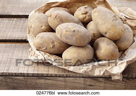 Stock Image - bag full of potatoes. Fotosearch