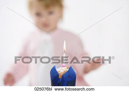 candle burning on muffin to celebrate baby´s first anniversary View Large Photo Image Stock Image - candle burning on muffin to celebrate baby´s first anniversary. Fotosearch