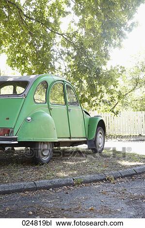citroen 2cv car standing in shadow of a tree View Large Photo Image Stock Image - citroen 2cv car standing in shadow of a tree. Fotosearch