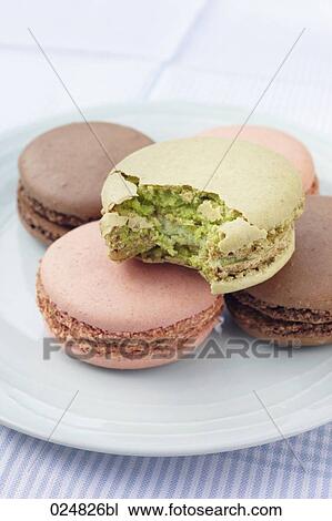 four macarons on plate one half eaten View Large Photo Image Stock Image - four macarons on plate one half eaten. Fotosearch
