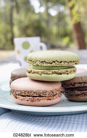 four macarons on plate View Large Photo Image Stock Image - four macarons on plate. Fotosearch