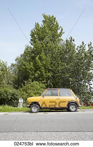 Mini Cooper standing on road View Large Photo Image Stock Image - Mini Cooper standing on road. Fotosearch