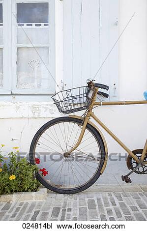 old bicycle leaning against house View Large Photo Image Stock Image - old bicycle leaning against house. Fotosearch
