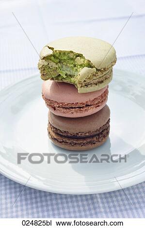 pile of three macarons one half eaten View Large Photo Image Stock Image - pile of three macarons one half eaten. Fotosearch