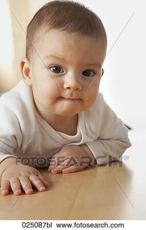 portrait of baby lying on floor View Large Photo Image Stock Image - portrait of baby lying on floor. Fotosearch