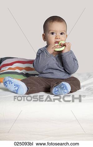portrait of baby with teething ring View Large Photo Image Stock Image - portrait of baby with teething ring. Fotosearch