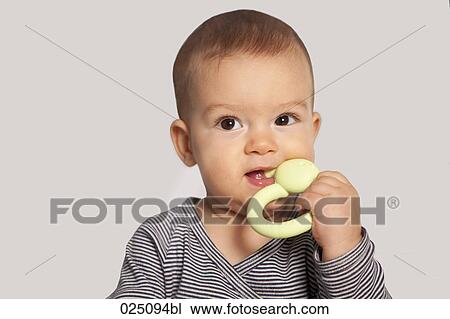 portrait of baby with teething ring View Large Photo Image Stock Image - portrait of baby with teething ring. Fotosearch