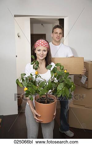 portrait of young couple moving into new flat View Large Photo Image Stock Image - portrait of young couple moving into new flat. Fotosearch