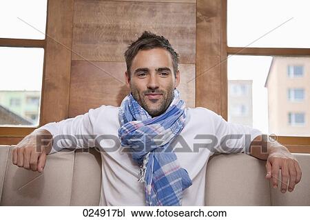portrait of young man wearing scarf View Large Photo Image Stock Image - portrait of young man wearing scarf. Fotosearch