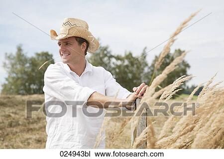 portrait of young man with straw hat in field View Large Photo Image Stock Image - portrait of young man with straw hat in field. Fotosearch