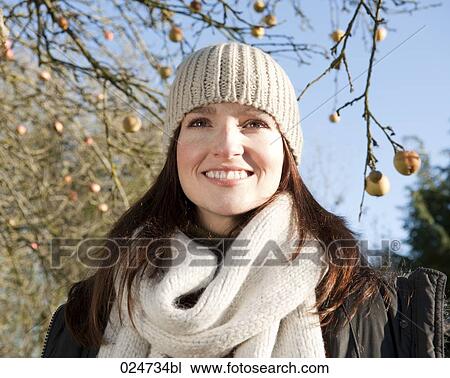 portrait of young woman outdoors wearing warm winter close View Large Photo Image Stock Image - portrait of young woman outdoors wearing warm winter close. Fotosearch