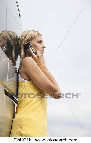 portrait of young woman talking on mobile phone View Large Photo Image Stock Image - portrait of young woman talking on mobile phone. Fotosearch