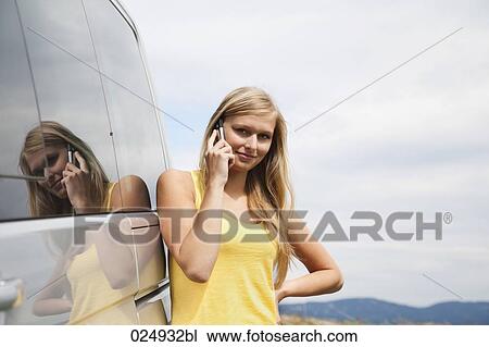 portrait of young woman talking on mobile phone View Large Photo Image Stock Image - portrait of young woman talking on mobile phone. Fotosearch
