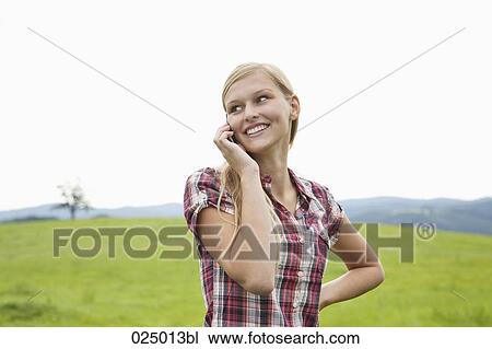 portrait of young woman talking on mobile phone View Large Photo Image Stock Image - portrait of young woman talking on mobile phone. Fotosearch