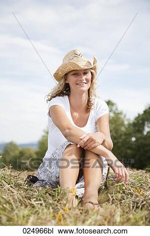 portrait of young woman with straw hat in field View Large Photo Image Stock Image - portrait of young woman with straw hat in field. Fotosearch
