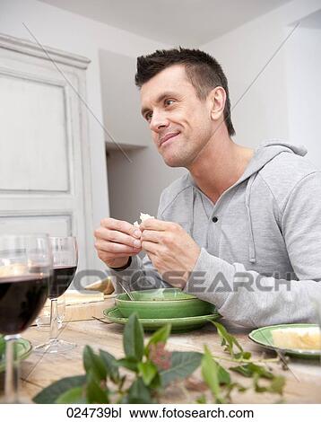 portrait young man eating bread View Large Photo Image Stock Image - portrait young man eating bread. Fotosearch