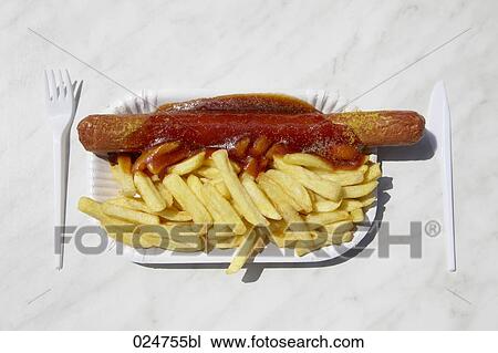 still life of currywurst and chips on paper plate View Large Photo Image Stock Image - still life of currywurst and chips on paper plate. Fotosearch
