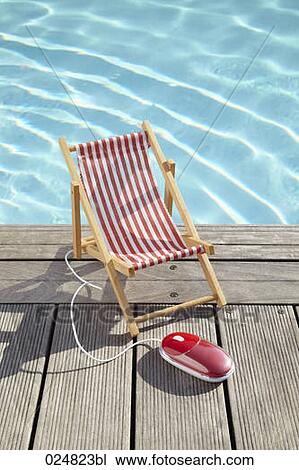 sun lounger and computer mouse on planks at swimming pool View Large Photo Image Stock Image - sun lounger and computer mouse on planks at swimming pool. Fotosearch
